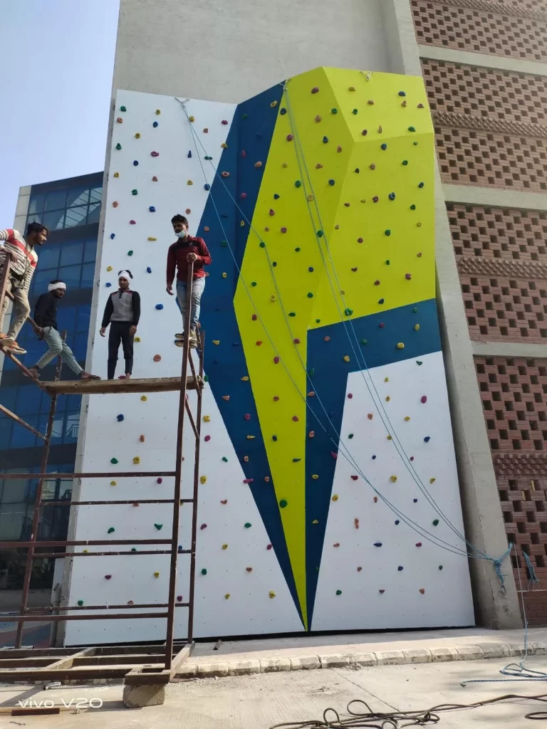 an outdoor climbing wall attached to a school building