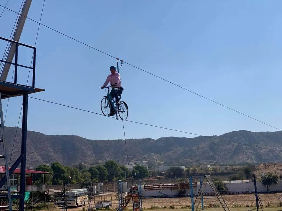 A rider doing sky cycling at nest sky cycling setup in India