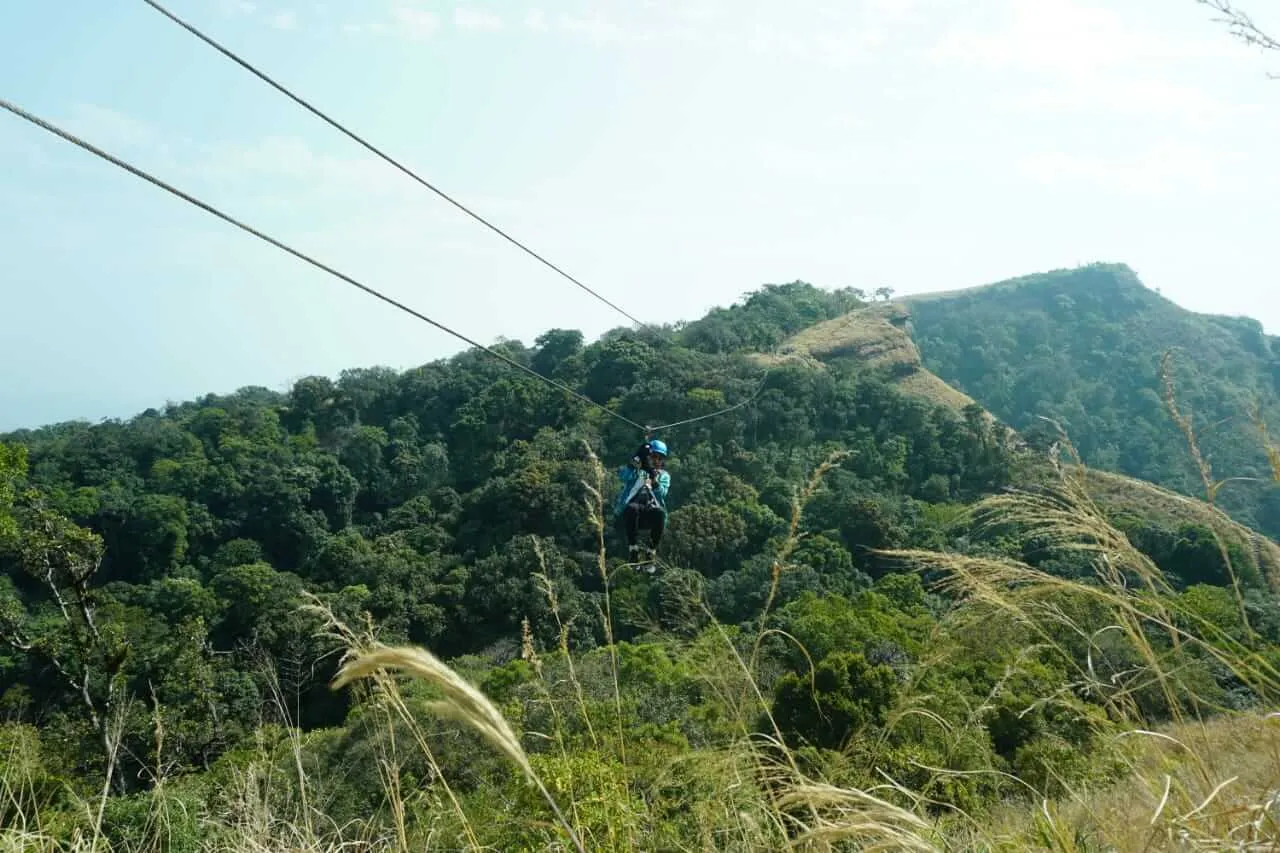A rider going on zipline setup built by Oxo